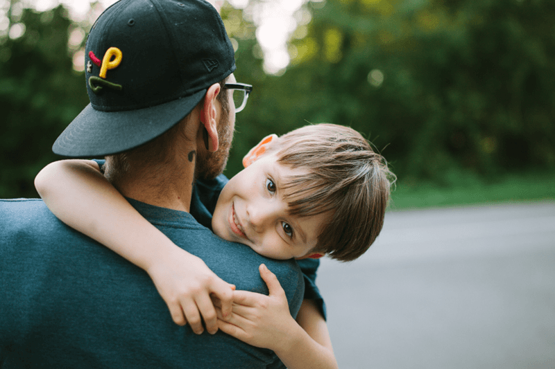 son hugging his dad