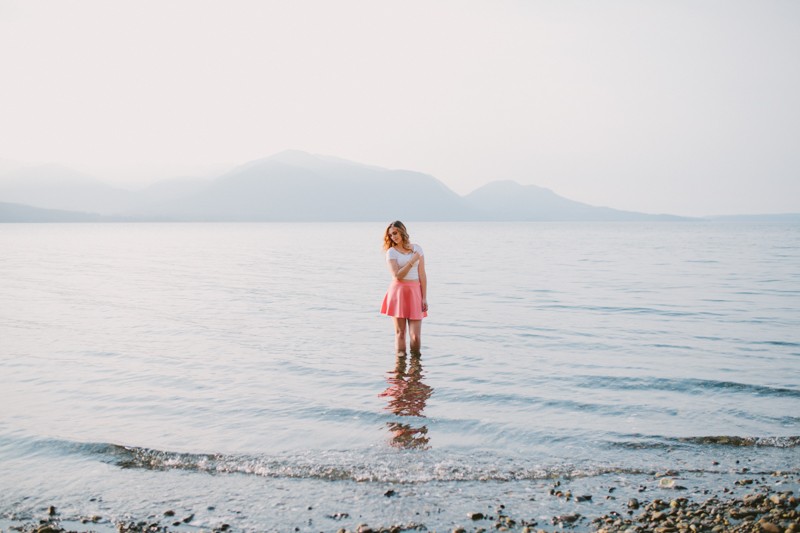Olympic High School senior standing in water in the Hood Canal, by Meghann Prouse. 