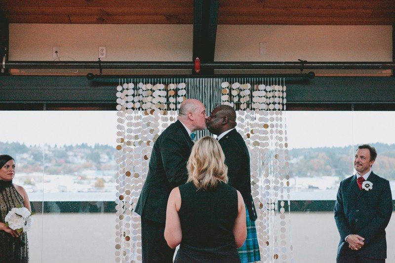 Same sex wedding ceremony at Olympic Rooftop Pavilion in Seattle, Washington. 