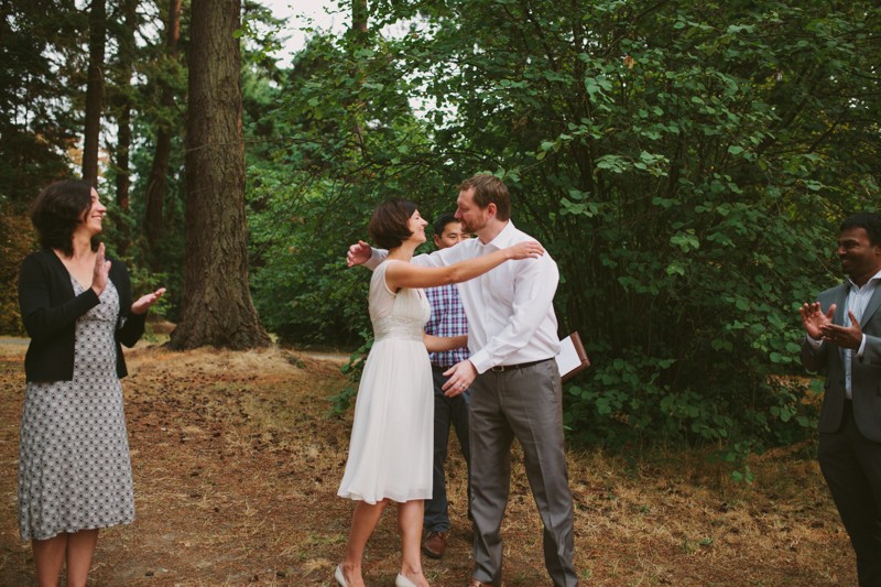 Bride and groom hug after wedding ceremony. 