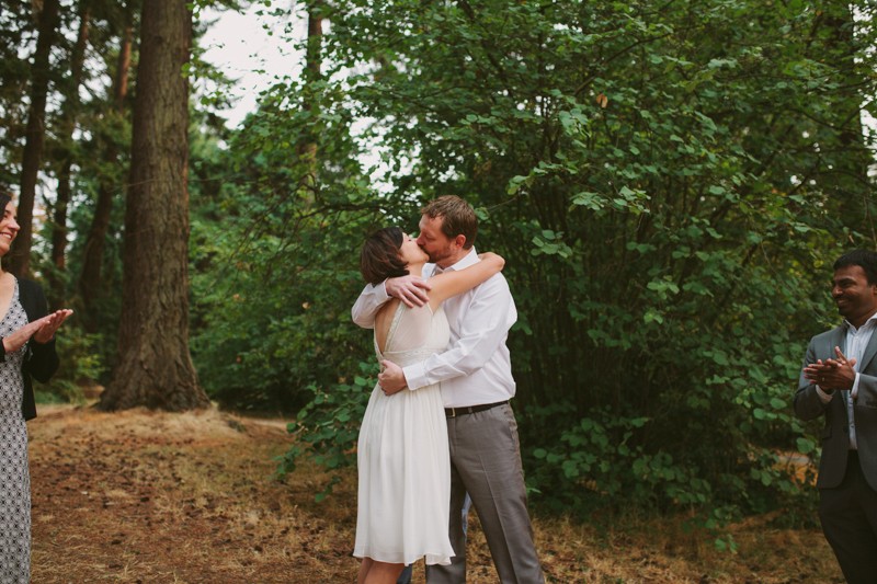 Bride and groom first kiss, at Lincoln Park in West Seattle. 