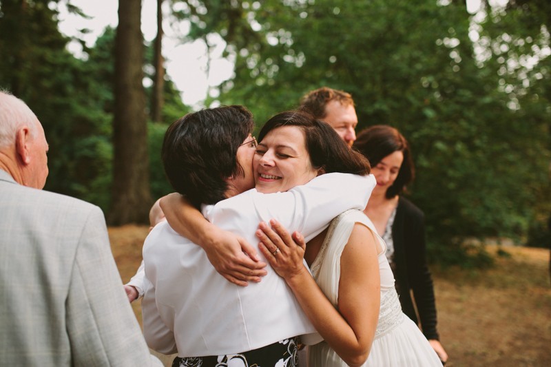 Bride hugging her mother. 