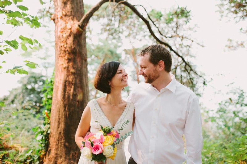 West Seattle bride and groom smiling at each other. 