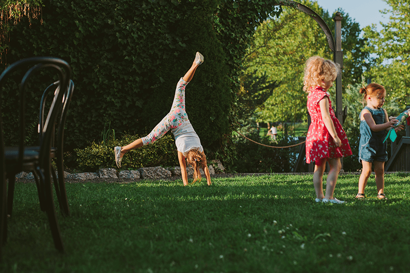 Little girl doing a cartwheel in Bremerton, WA. 