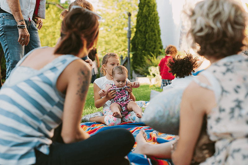 Guests having fun at a summer baby shower. 