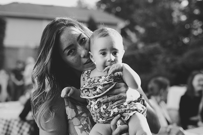 Mom-to-be holding her baby niece at her baby shower. 