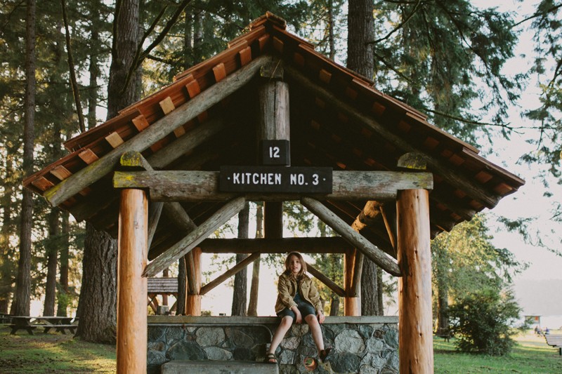 Adventuring at Twanoh State Park, with boy sitting under a kitchen shelter.
