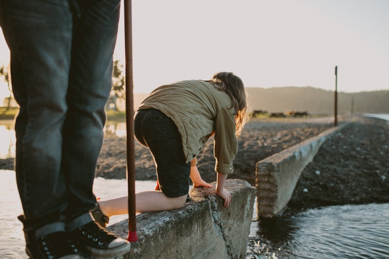 Boy admiring the water at sunset in Twanoh State Park.