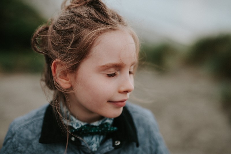 WIndblown hair strands at the beach in Port Townsend, WA.