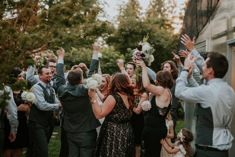 Celebratory cheers from the wedding party, after the ceremony, at Black Diamond Gardens. 