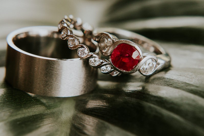 Non-traditional wedding ring set, with pave diamond band and red stone engagement ring.
