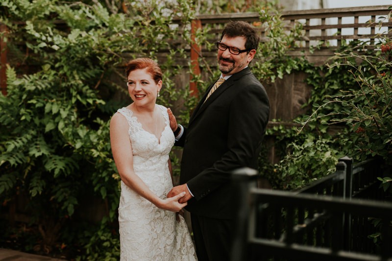 Sweet bride and groom laughing after their first look.