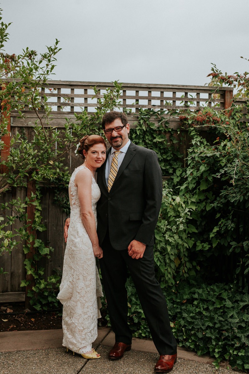 Modern Tacoma bride and groom, with groom in a black suit and leather oxford shoes.