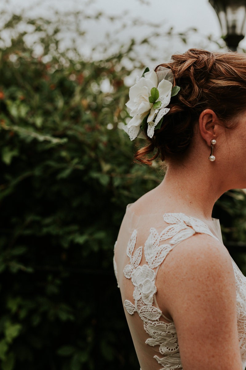 Classic bridal up-do with a delicate, fresh Gardenia flower accessory.