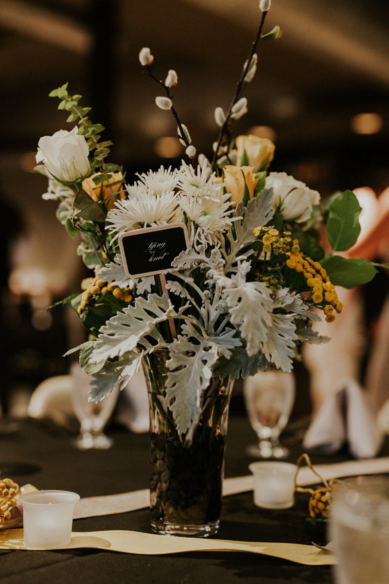 Modern floral centerpiece, with Dusty Miller, Pussy Willow branches, Roses and Mums.