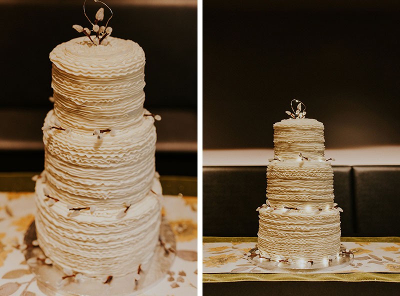 Darling three-tier ruffled wedding cake, with lights and Pussy Willow branches.