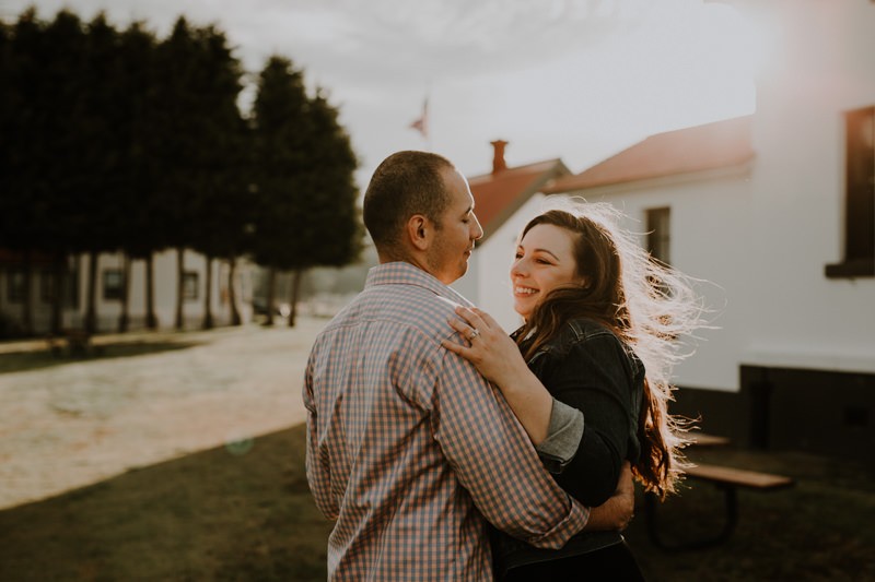 Playful beach and lighthouse engagement session in Kitsap County, Washington state. 
