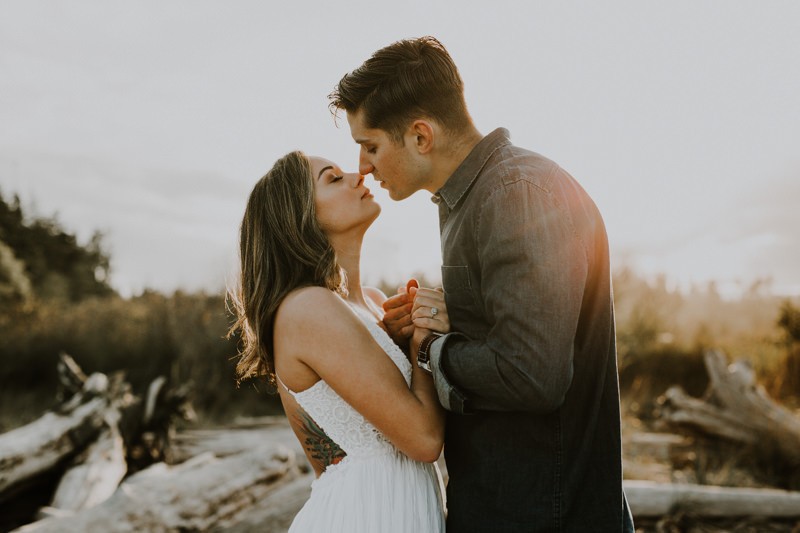Romantic engagement session at the beach at sunset in Kitsap County. 