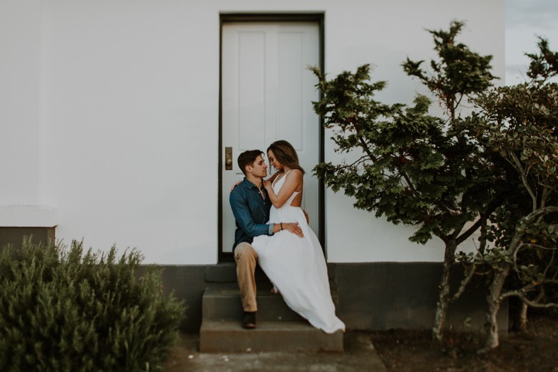 Moody and intimate engagement session at historic beach lighthouse. 