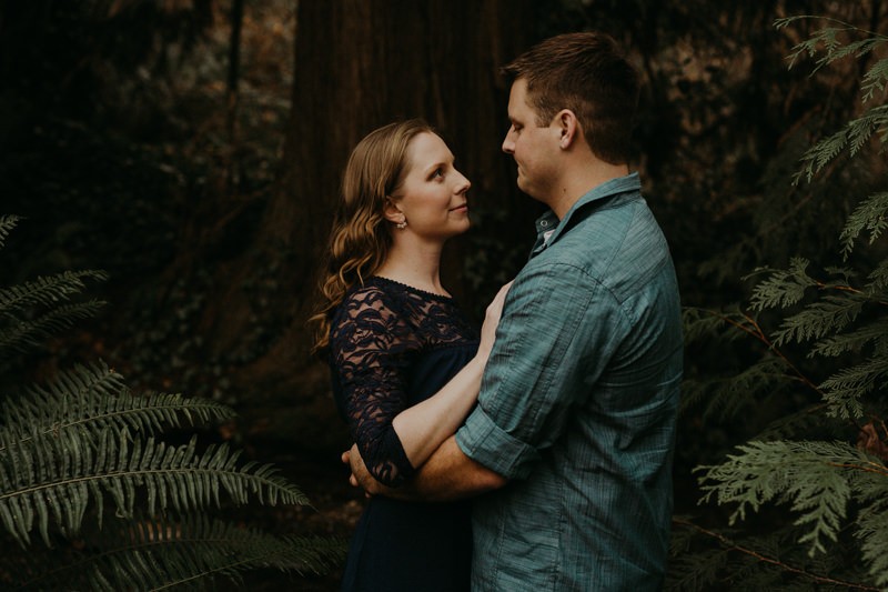 Fun PNW engagement session surrounded by forest and ferns. 